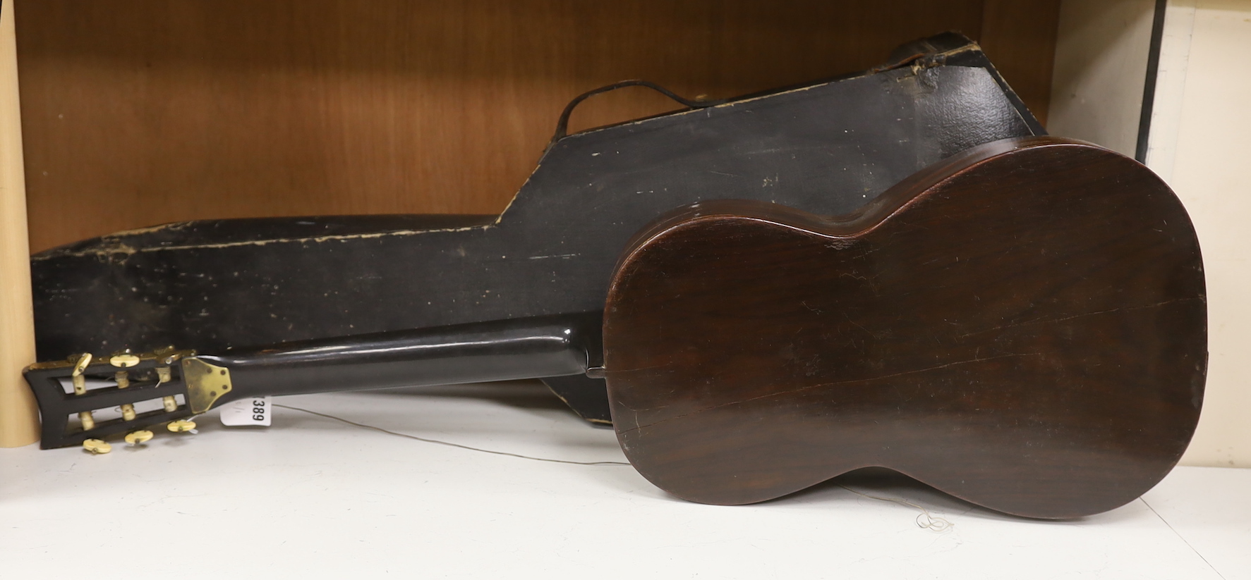 A parlour guitar with hard case. Ivory submission reference: J3WBGCHD